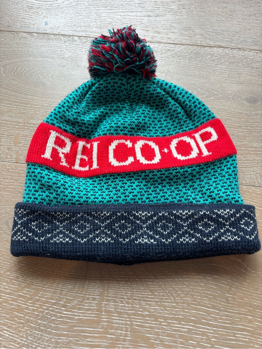 REI Teal Beanie with Red Logo Band and Navy Cuff